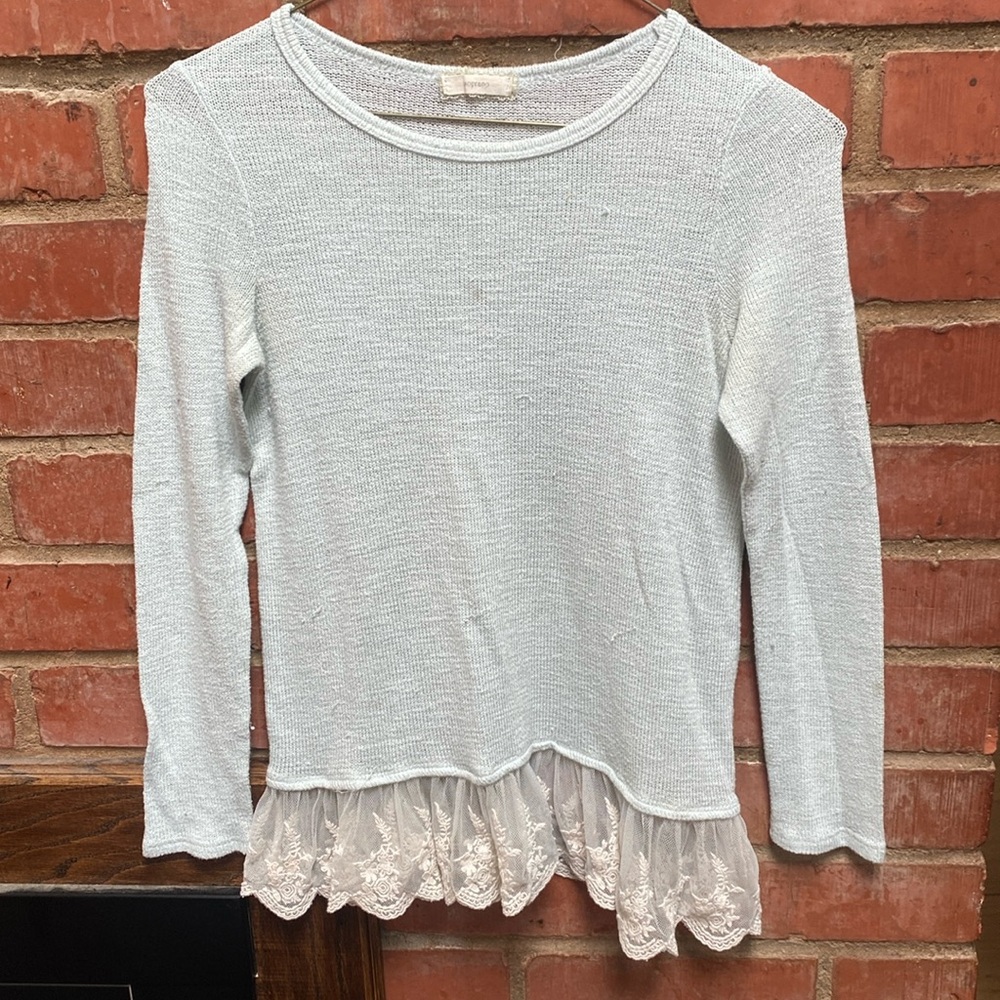 Delicate lace peplum edge sweater by Soprano